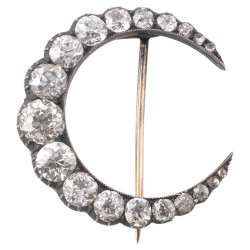 A Crescent Moon Brooch with...