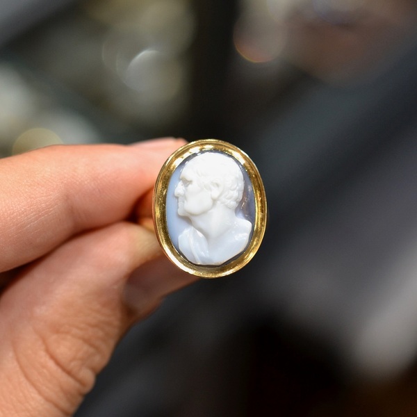 Late 18th Century Agate Cameo Cicerone Ring #bernardo 

A late 18th century white layered agate on a light gray ground, set in a gold frame. Male head with short hair, possibly the Roman orator, politician, writer and philosopher Cicero, cameo circa 1790, the setting is 18kt gold. The top measuring 2,6cm x 2,1cm